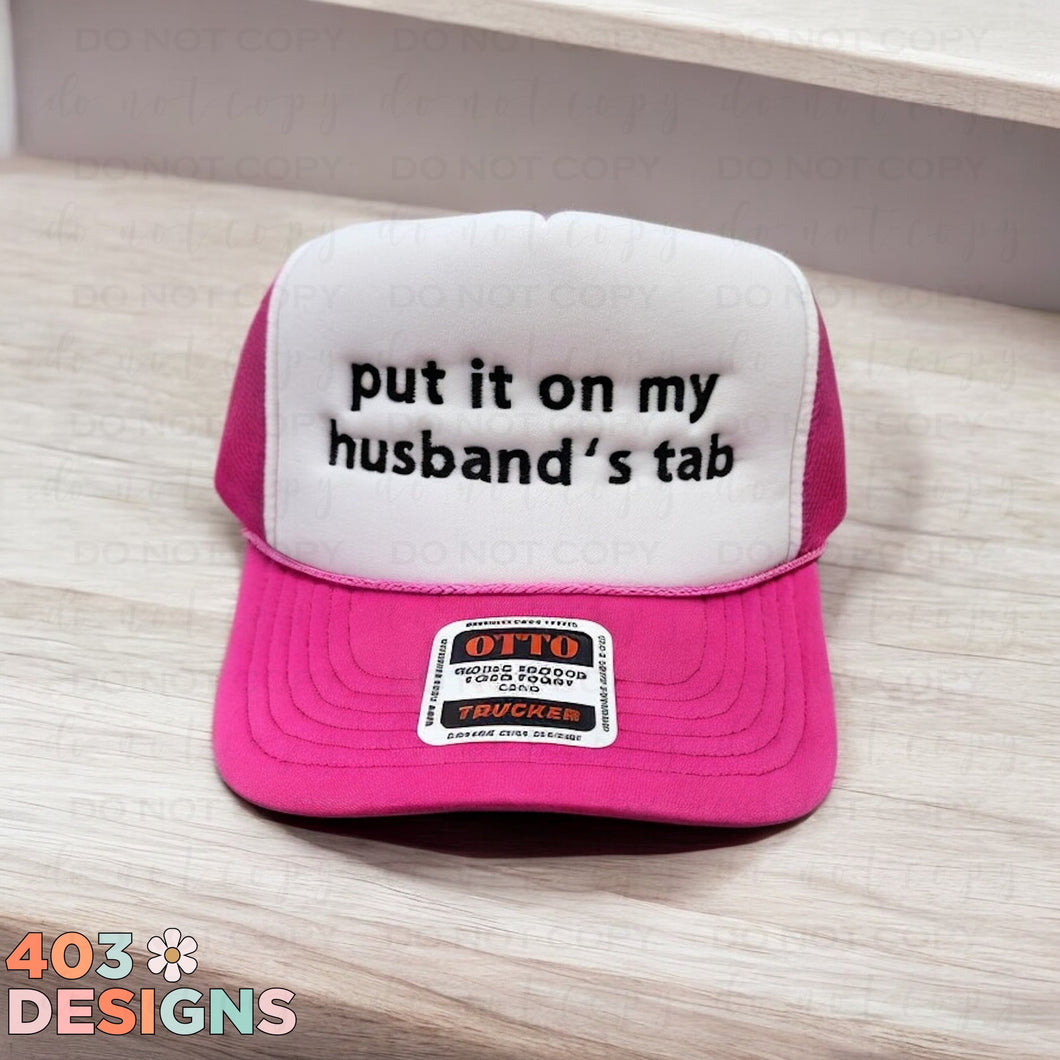 Put It On My Husband's Tab Embroidered Trucker Hat